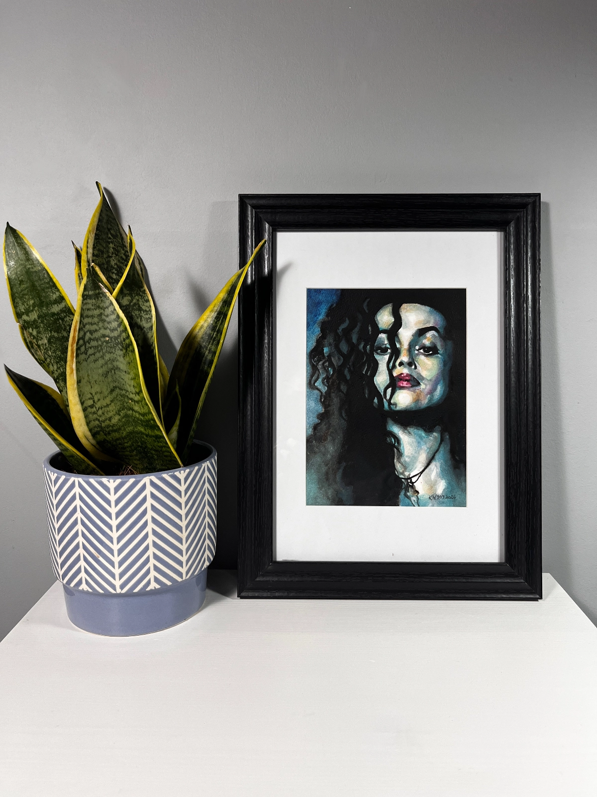 watercolor portrait of Bellatrix Lestrange from Harry Potter with dark tangled hair and intense gaze