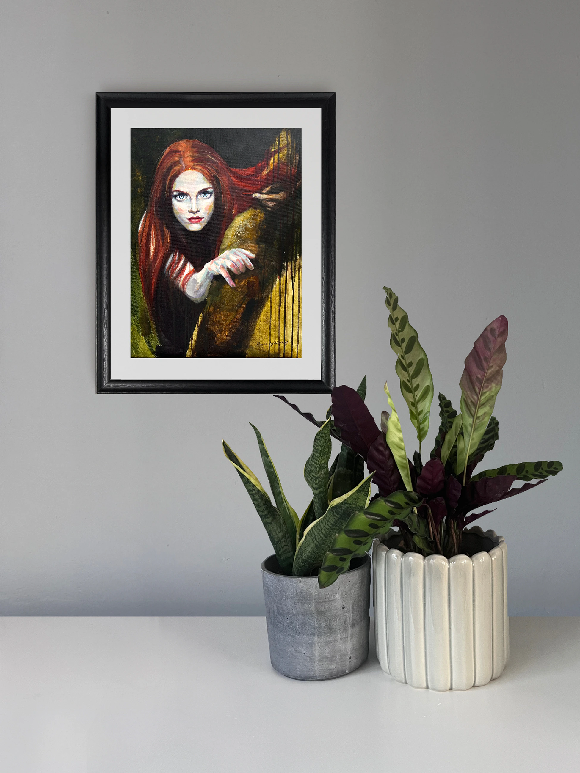 Red-haired woman looking directly at the viewer, with one hand extended against a dark green background